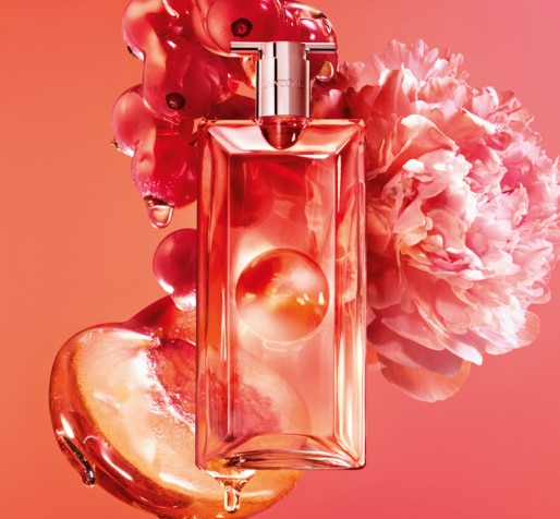 1.jpg Elegáns női parfümüveg virágos kompozícióban, meleg narancs árnyalatokkal