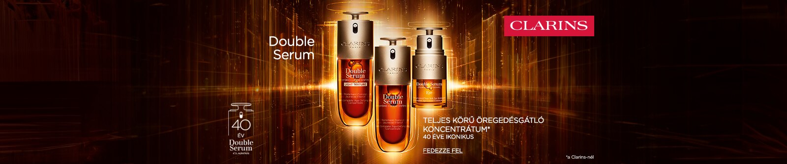 1600x335px-DoubleSerum-Desktop.png Clarins Double Serum – ikonikus öregedésgátló szérum 40 éve, bőrápolás arany háttérrel.